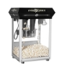 Used Snack Station 8oz black tabletop popcorn machine - front view with popcorn