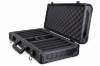 Open empty black aluminum poker chip case, angled view